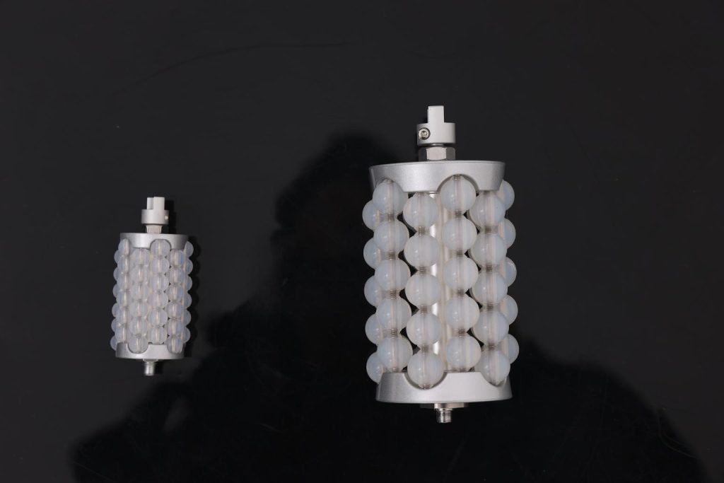 RF and LED roller handpiece modules on a black background