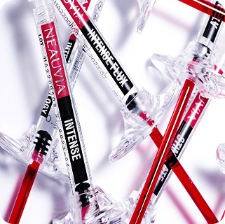 Neauvia Intense dermal filler syringes on an icy background