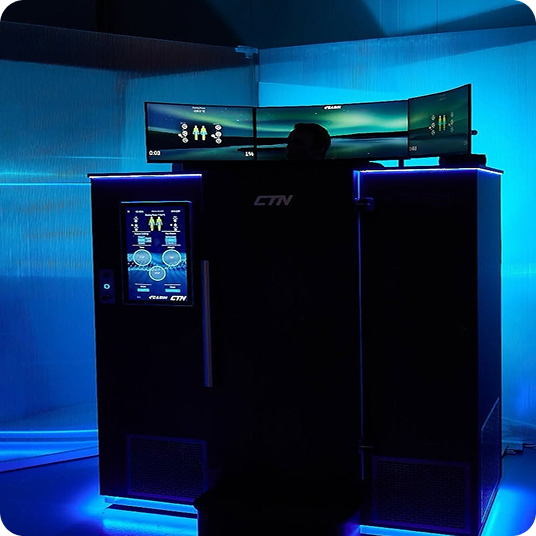 CTN wellness cabin lit in blue with a curved monitor