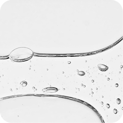 Clear serum droplets on a white surface