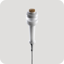 Aesthetic device handpiece with round applicator tip and cable