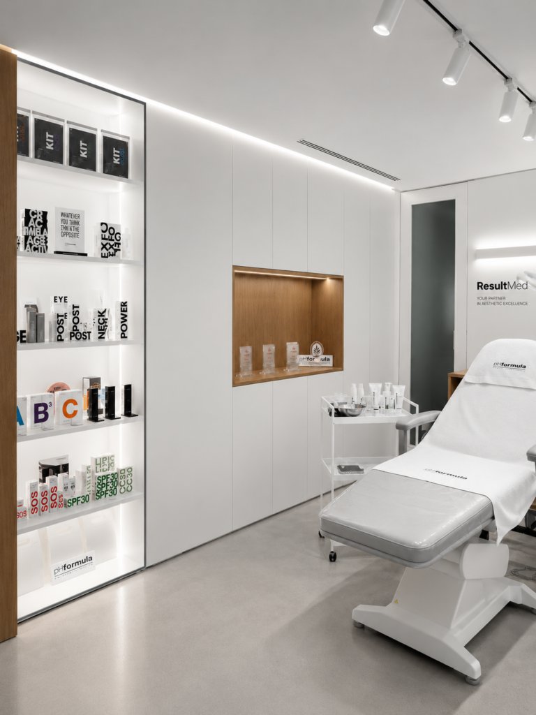 ResultMed treatment room with product display shelves and treatment bed