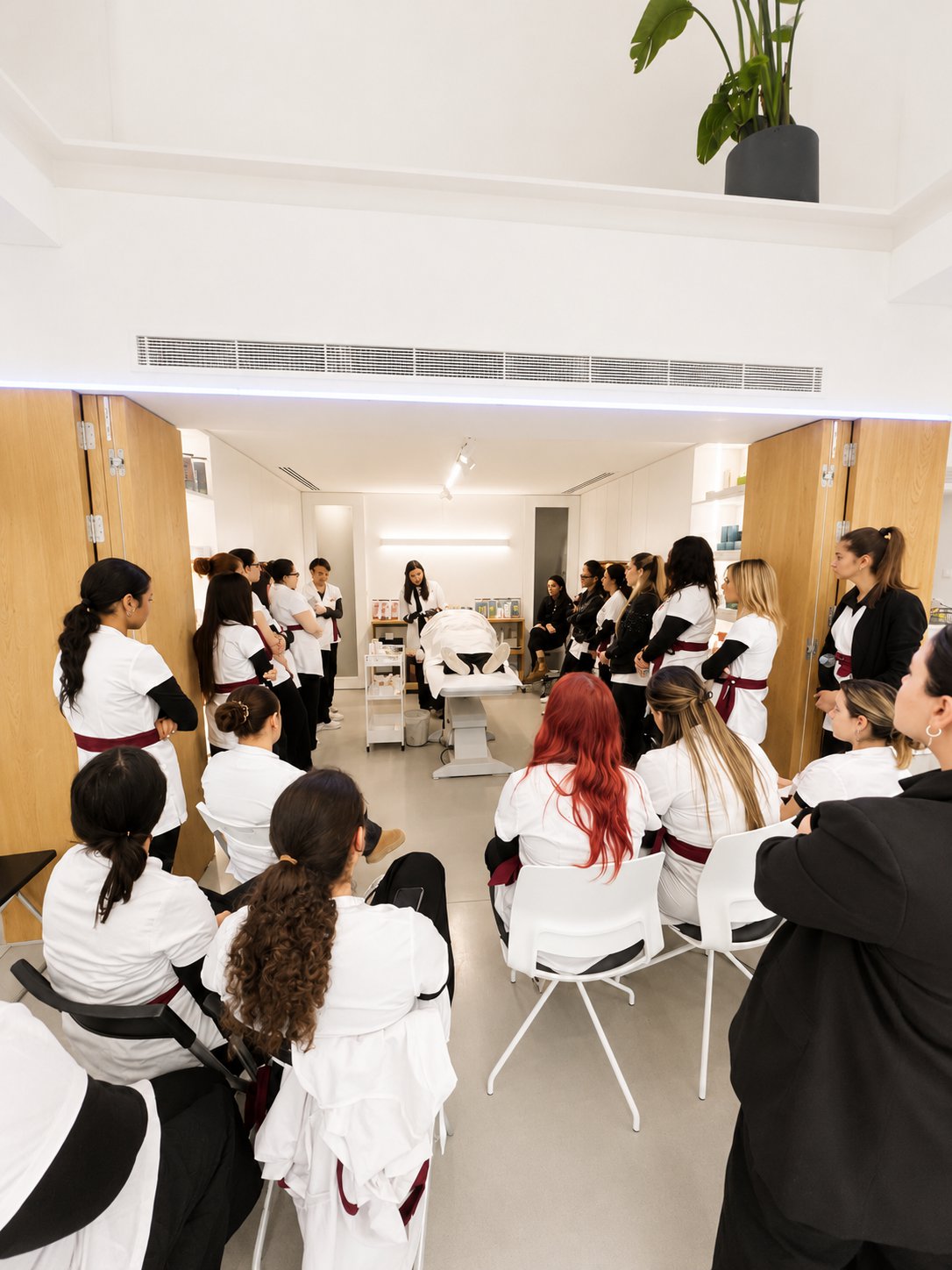 Attendees seated at a hands-on training demonstration